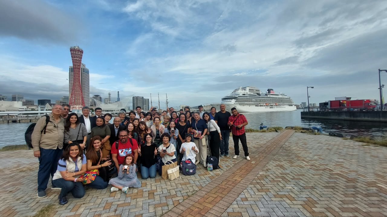 The team and friends by the bay in Kobe, Japan