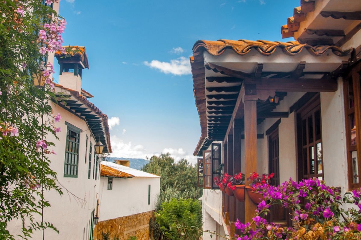 Whitewashed colonial houses with wooden balconies and bougainvillea in Villa de Leyva